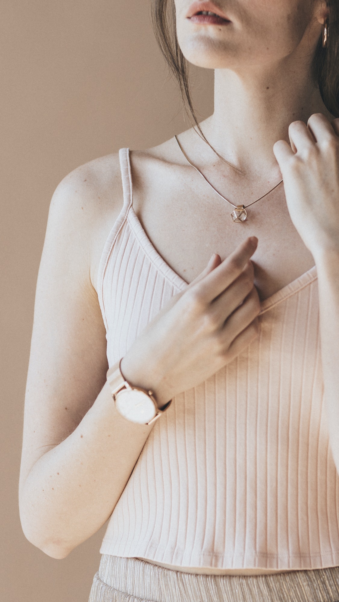 woman in a light pink tank top